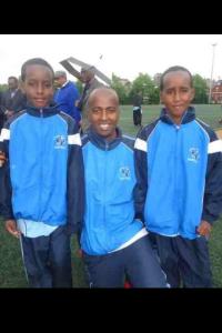 Role model: Farah with two young budding footballers